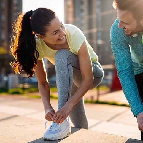 Woman and man going for a run after treatment for meniscal tear