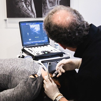 Dr. Tortland performing prolotherapy