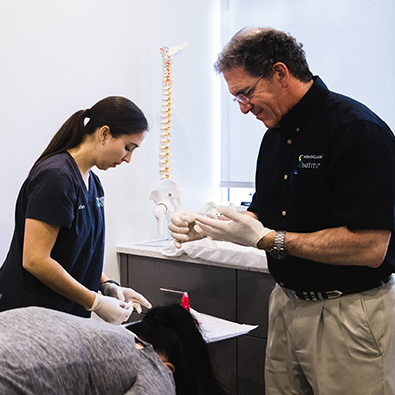 Doctor and team member treating patient