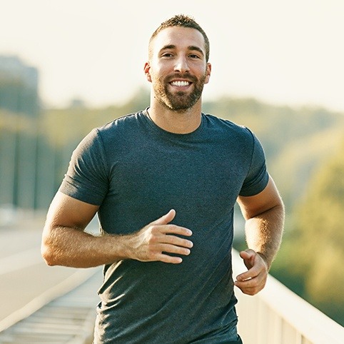 Man running after Achilles tendinitis treatment