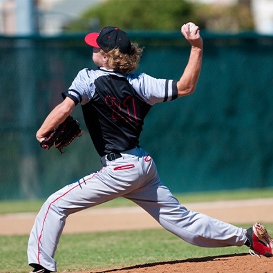 Preteen boy playing baseball