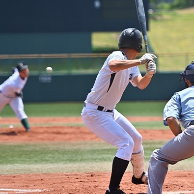 Teen boy playing baseball after shoulder impingement treatment