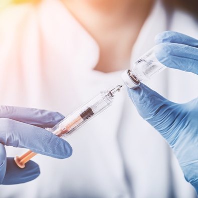 Doctor using injectable treatment for little league elbow