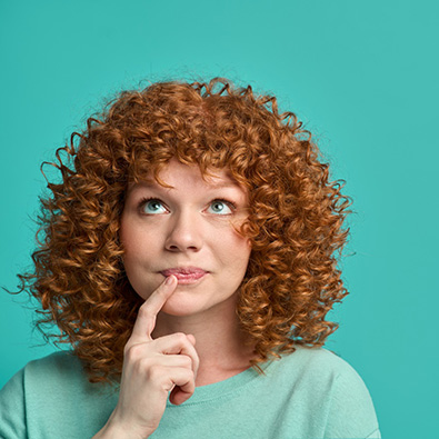 Curious woman against turquoise background