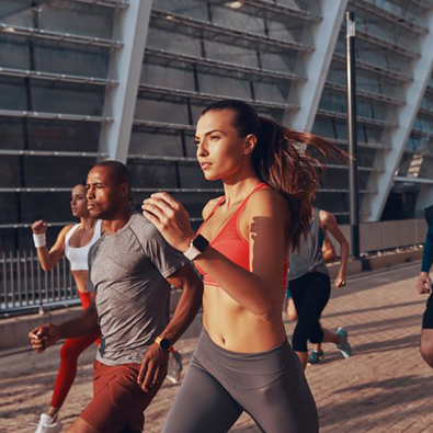 Group of people jogging in urban setting