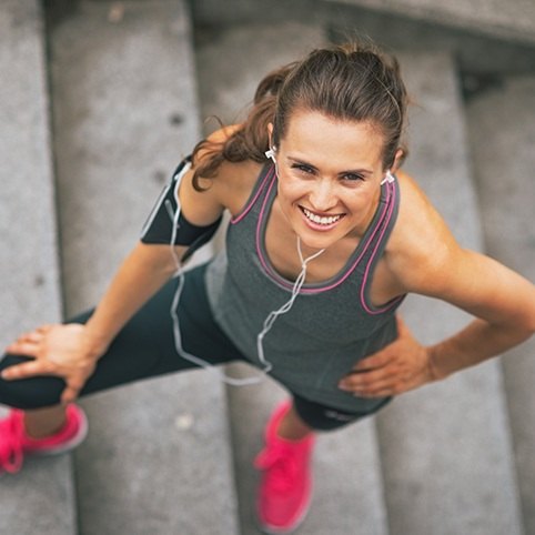 Woman exercising on stairs after sports medicine appointment