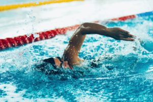 man swimming in Olympic pool 