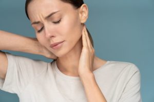 Woman with neck pain due to a trapped nerve
